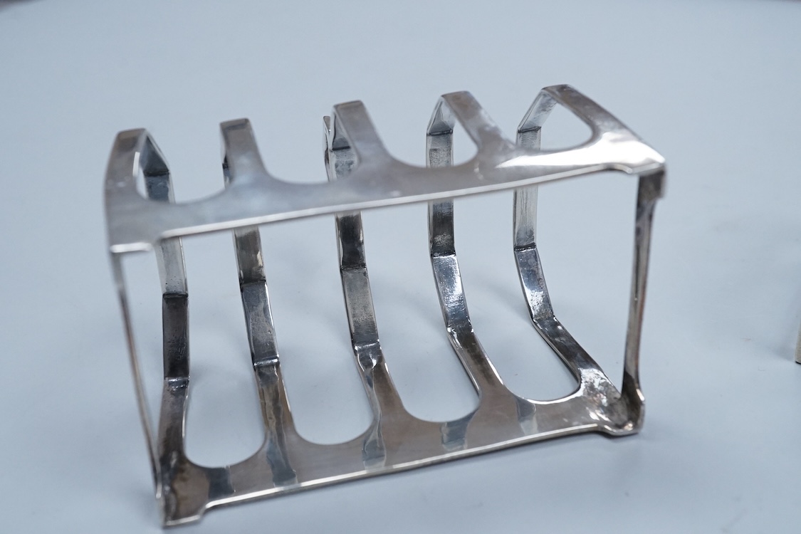 A pair of George V silver five bar toast racks, Viners Ltd, Sheffield, 1934, 75mm, 3.6oz.
